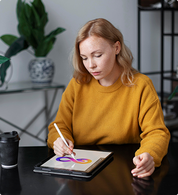 Designer sketching a logo on a tablet